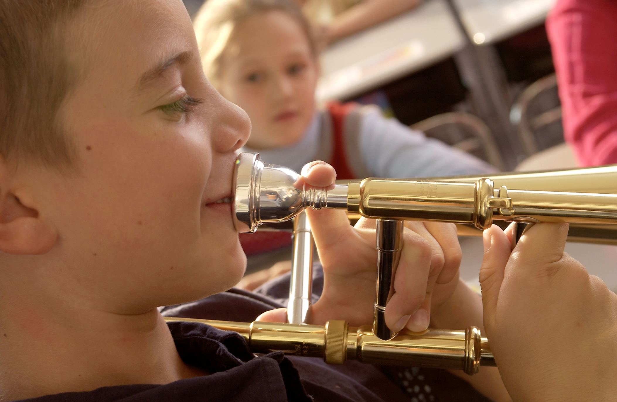 Young boy playing trombone