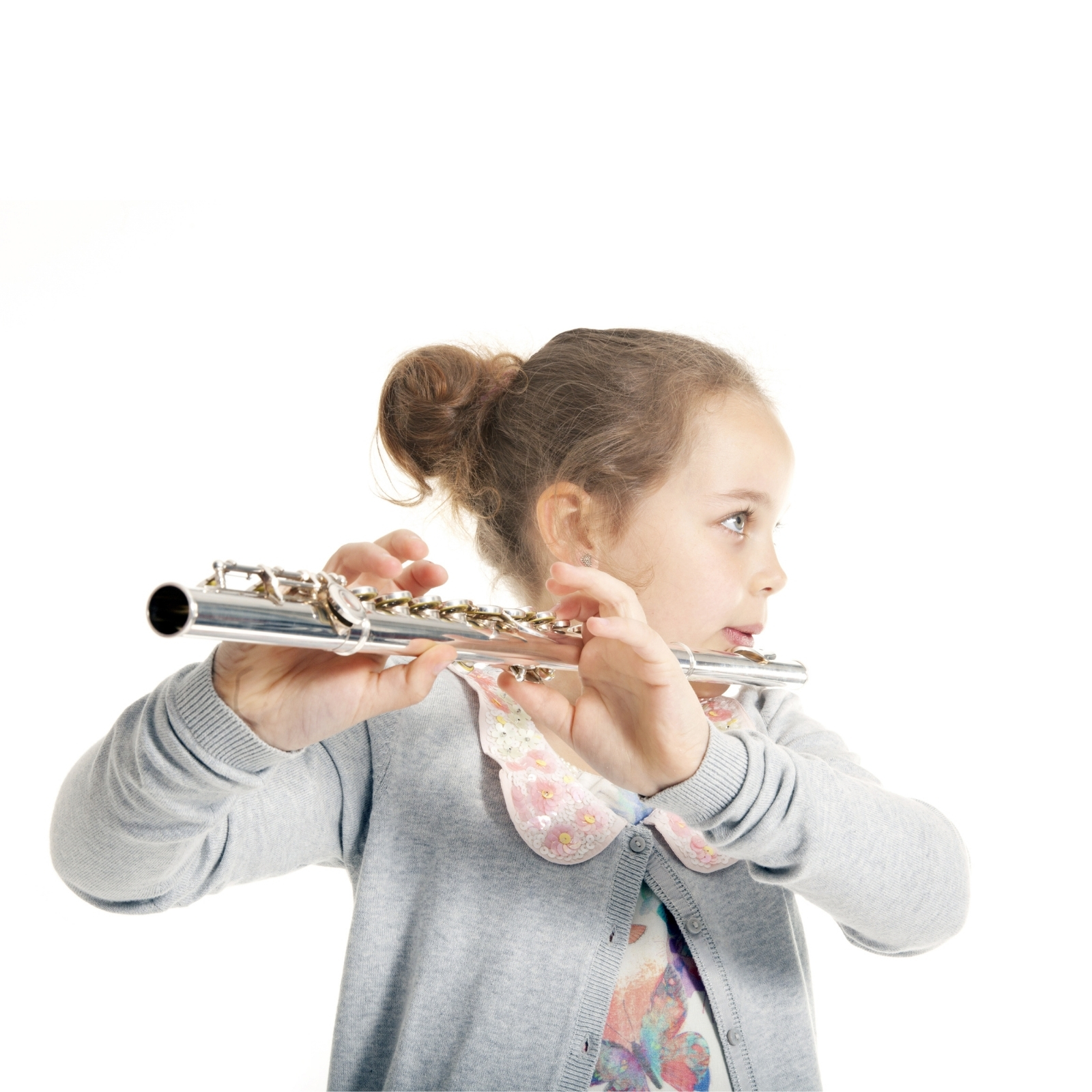 Young Girl Playing Flute against white background